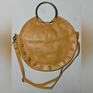Tan Circle Handbag with Metal Accents and Removable Strap